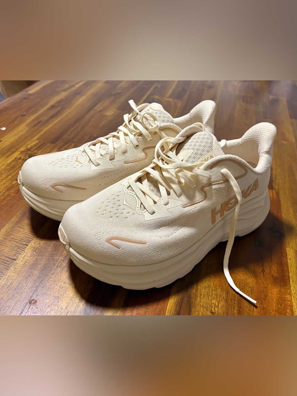 NWT . Hoka Women's Cream Athletic Running Shoes with Subtle Peach Accents.